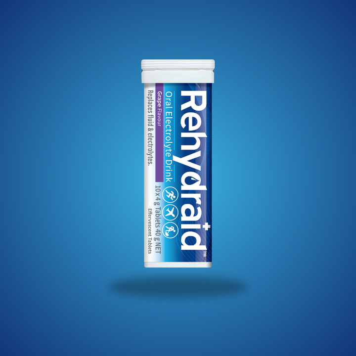 Rehydraid Oral Electrolyte Drink tube containing 10 effervescent tablets in grape flavour. The tube label indicates it replaces fluid and electrolytes, suitable for physical activity and travel.